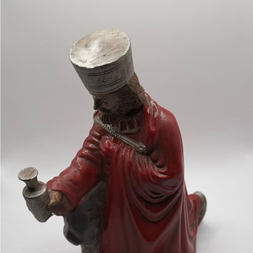 Red and Silver Kneeling Figurine